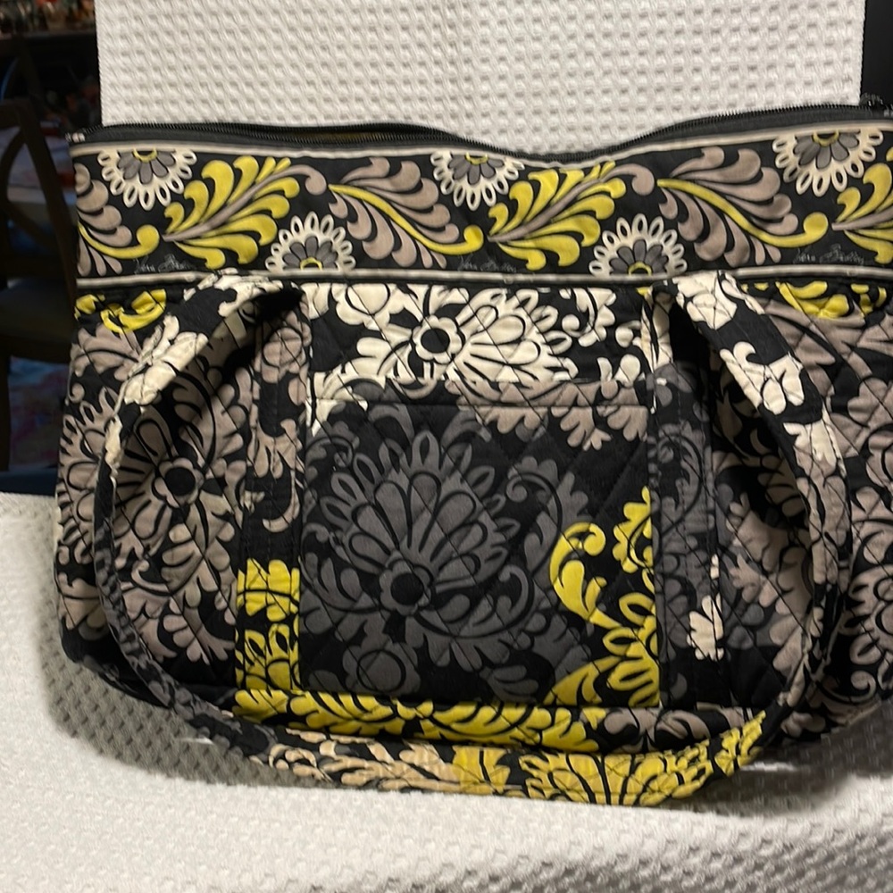Vera Bradley soft purse in colors of black, yellow and grey.
